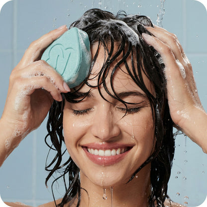 women washing hair with Blue Clay Repair shampoo bar for scalp detox and 
hair repair handmade in New Zealand by Norilum